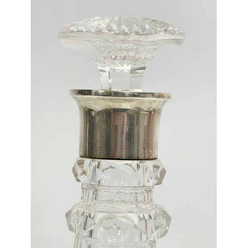 40 - Silver mounted. A Late 19th Century 3 ring glass decanter. Faded mark. London. 27.5cm.