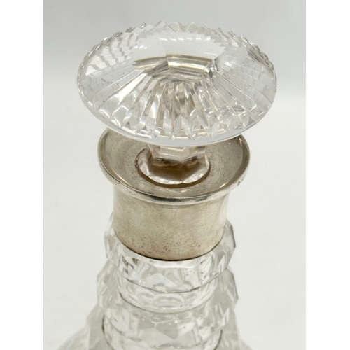 40 - Silver mounted. A Late 19th Century 3 ring glass decanter. Faded mark. London. 27.5cm.