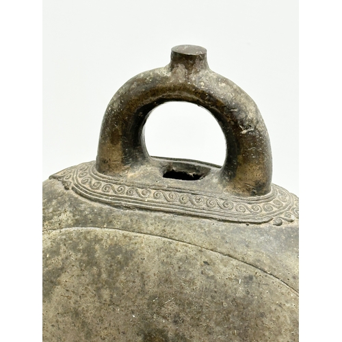 206 - A large 19th Century Burmese bronze bell. 23x14x36cm.