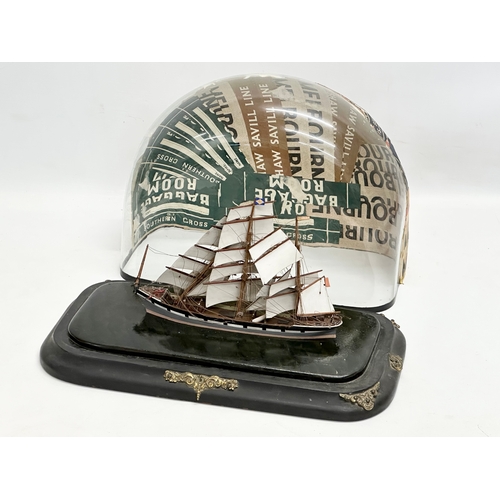 207 - A Late 19th/Early 20th Century model ship in glass domed case. 38x20x28cm.