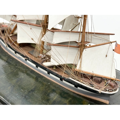 207 - A Late 19th/Early 20th Century model ship in glass domed case. 38x20x28cm.