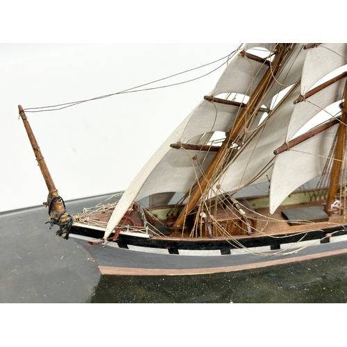 207 - A Late 19th/Early 20th Century model ship in glass domed case. 38x20x28cm.