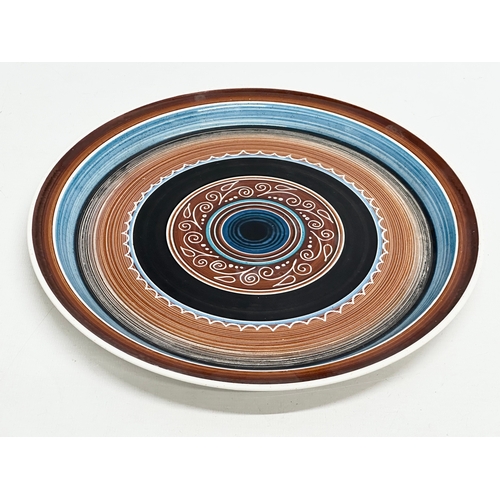 457 - An Irish glazed stoneware plate. Dated June, 1974. 27cm