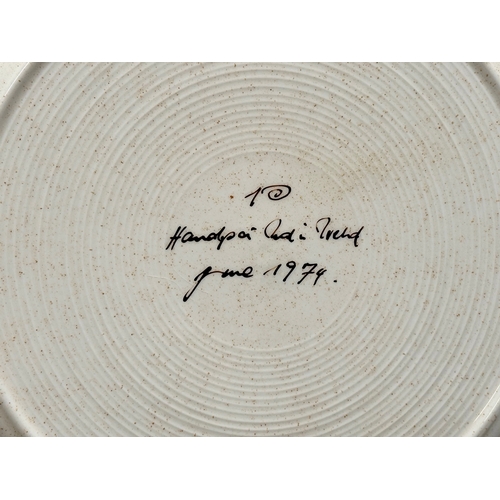 457 - An Irish glazed stoneware plate. Dated June, 1974. 27cm