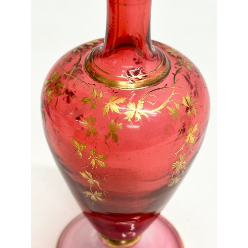 217 - A Late 19th Century Bohemian, Moser style cranberry glass bottle vase, with hand painted gilt leaves... 