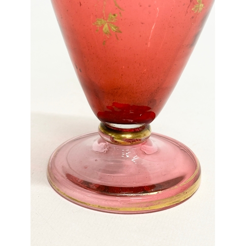 217 - A Late 19th Century Bohemian, Moser style cranberry glass bottle vase, with hand painted gilt leaves... 