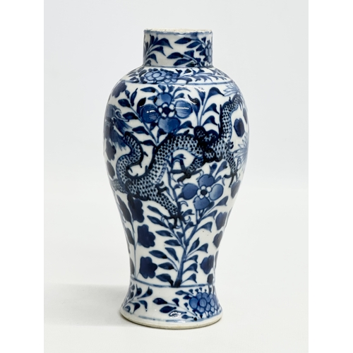 224 - A 19th Century Chinese blue and white baluster vase. Kangxi 4 character. 18.5cm.