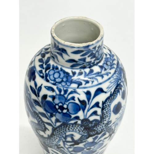 224 - A 19th Century Chinese blue and white baluster vase. Kangxi 4 character. 18.5cm.