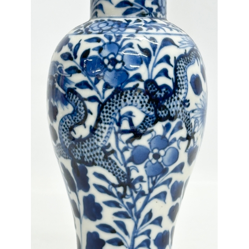 224 - A 19th Century Chinese blue and white baluster vase. Kangxi 4 character. 18.5cm.