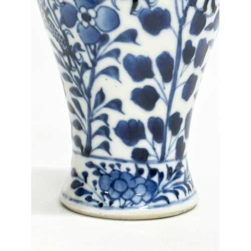 224 - A 19th Century Chinese blue and white baluster vase. Kangxi 4 character. 18.5cm.