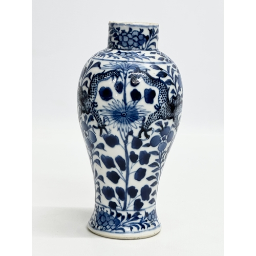 224 - A 19th Century Chinese blue and white baluster vase. Kangxi 4 character. 18.5cm.