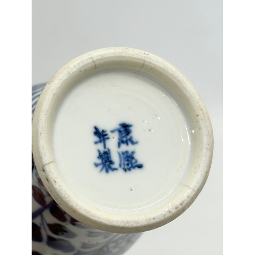 224 - A 19th Century Chinese blue and white baluster vase. Kangxi 4 character. 18.5cm.