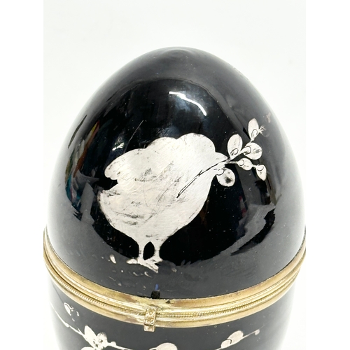 232 - A Late 19th/Early 20th Century painted glass egg shaped drinking box. 15cm.