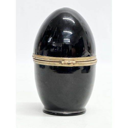 232 - A Late 19th/Early 20th Century painted glass egg shaped drinking box. 15cm.