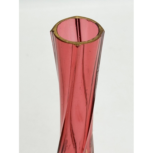 233 - An Early 20th Century cranberry glass footed vase. 22cm