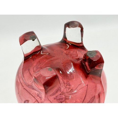 233 - An Early 20th Century cranberry glass footed vase. 22cm