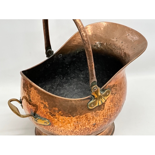 241 - A Victorian copper coal scuttle. 42x28x27cm