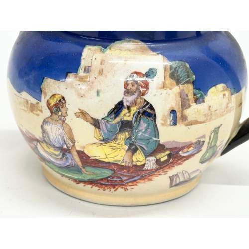 236 - An Early 20th Century Britannia Pottery Omar Khayyam jug. 17x13x12cm.