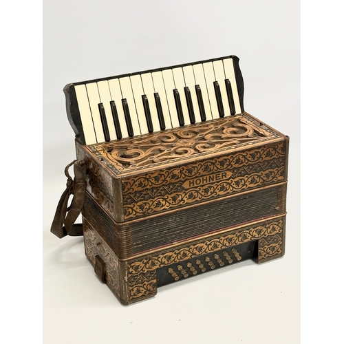 14 - A Late 19th/Early 20th Century Hohner carved fretwork accordion.