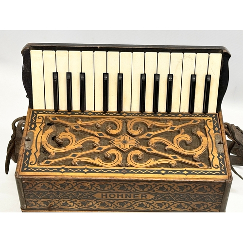 14 - A Late 19th/Early 20th Century Hohner carved fretwork accordion.