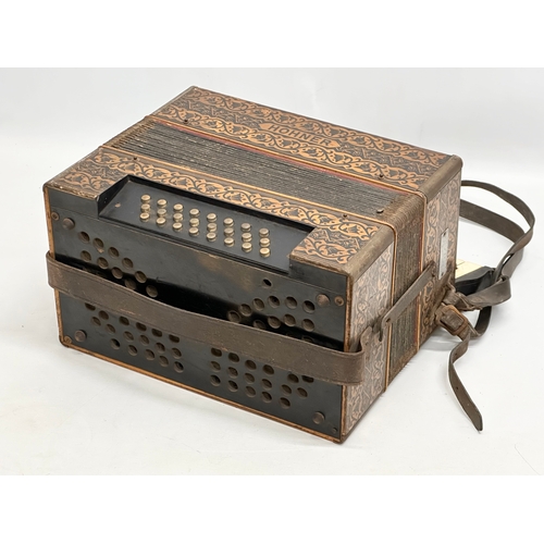 14 - A Late 19th/Early 20th Century Hohner carved fretwork accordion.