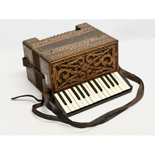 14 - A Late 19th/Early 20th Century Hohner carved fretwork accordion.