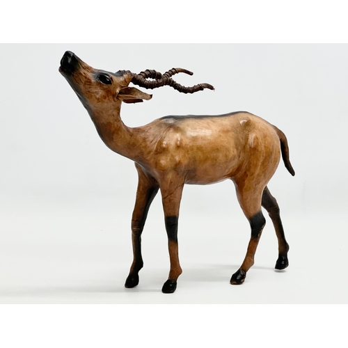 239 - A large Mid 20th Century leather antelope. 33x29cm