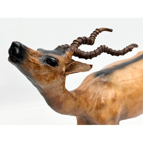 239 - A large Mid 20th Century leather antelope. 33x29cm