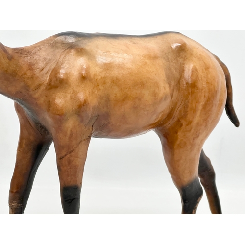 239 - A large Mid 20th Century leather antelope. 33x29cm