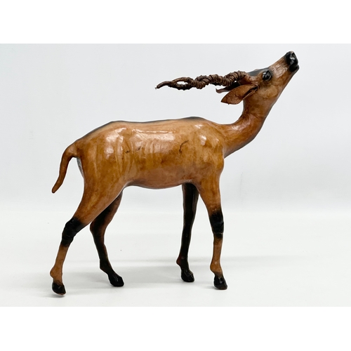 239 - A large Mid 20th Century leather antelope. 33x29cm