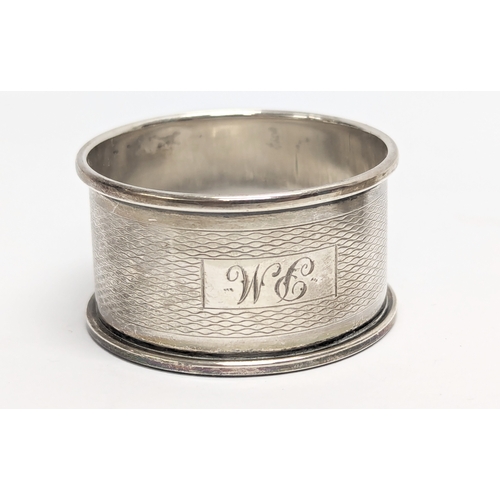 505 - A pair of silver napkin rings by E J Trevitt & Sons.  Chester. With other by Francis Howard Ltd, Bir... 