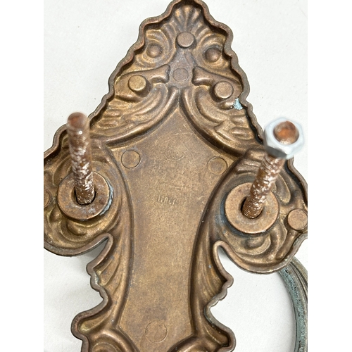 243 - A Late 19th Century door knocker, together with an Early/Mid 20th Century Italian door knocker. 21cm... 