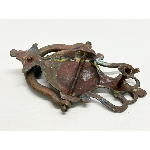 243 - A Late 19th Century door knocker, together with an Early/Mid 20th Century Italian door knocker. 21cm... 