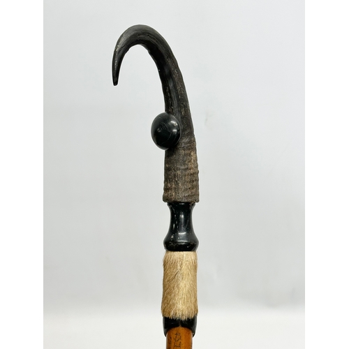 246 - St Beatenberg. A Late 19th/Early 20th Century walking stick. With a chamois horn handle. 100cm