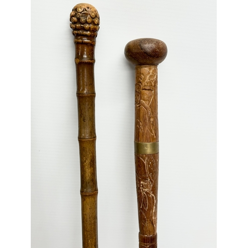 247 - A collection of vintage walking sticks. Induding a horse measuring stick.