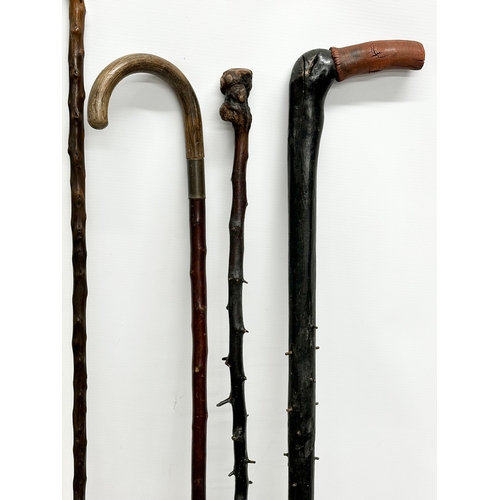 248 - A collection of vintage walking sticks. Including 1 silver mounted.