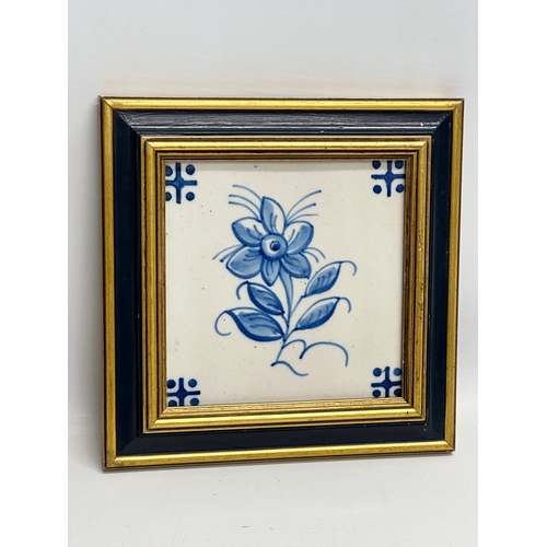 450 - A pair of framed vintage ceramic tiles. 19.5x19.5cm.