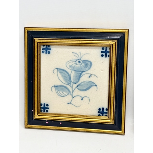 450 - A pair of framed vintage ceramic tiles. 19.5x19.5cm.