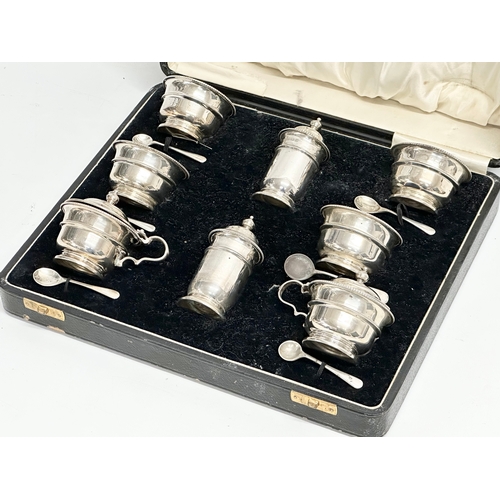 529 - A large silver condiment set in case. Birmingham 1932. Without liners 328.25 grams. 28x23x8cm