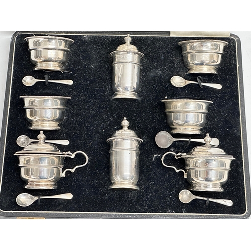 529 - A large silver condiment set in case. Birmingham 1932. Without liners 328.25 grams. 28x23x8cm