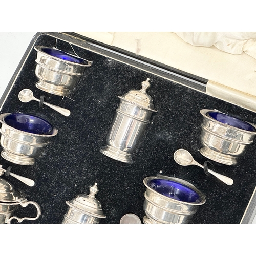 529 - A large silver condiment set in case. Birmingham 1932. Without liners 328.25 grams. 28x23x8cm