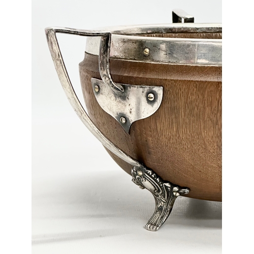 543 - An Early 20th Century oak trophy bowl with silver plated mounts. Circa 1910. 29x28x13cm.