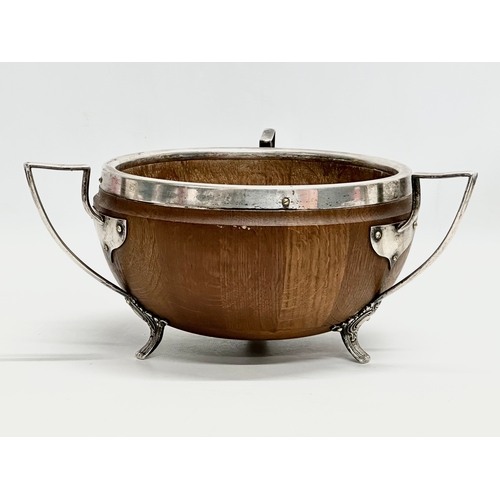 543 - An Early 20th Century oak trophy bowl with silver plated mounts. Circa 1910. 29x28x13cm.