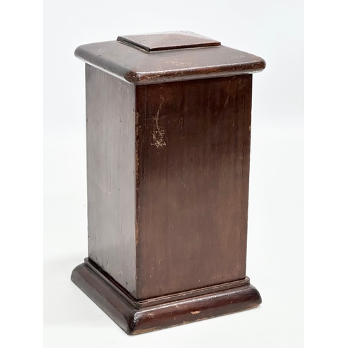 546 - An Edwardian mahogany puzzle box/money box. 11x11x20cm.