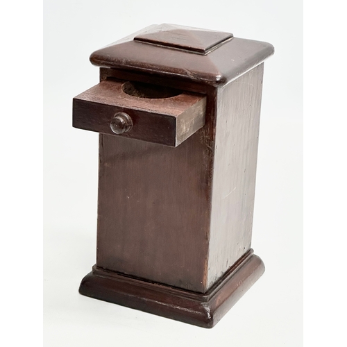 546 - An Edwardian mahogany puzzle box/money box. 11x11x20cm.