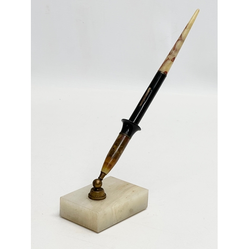 401A - A 14k gold nib. An Early 20th Century fountain pen desk set on marble stand. 25cm