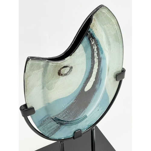 549 - A large Modernist glass sculpture on metal stand. 24x42cm