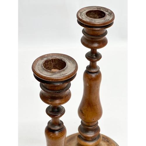 556 - A pair of Late 19th Century Victorian turned pearwood/fruitwood candlsticks. 26cm