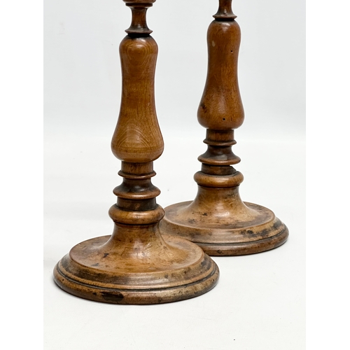 556 - A pair of Late 19th Century Victorian turned pearwood/fruitwood candlsticks. 26cm