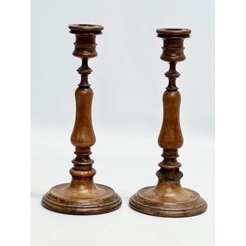 556 - A pair of Late 19th Century Victorian turned pearwood/fruitwood candlsticks. 26cm